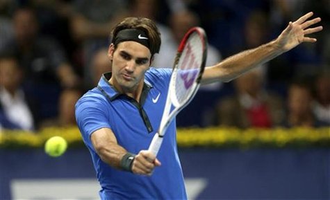 Switzerland's Roger Federer returns the ball during his semi-final match against Paul-Henri Mathieu of France at the Swiss Indoors ATP tenni Switzerland's Roger Federer returns the ball during his semi-final match against Paul-Henri Mathieu of France at the Swiss Indoors ATP tenni