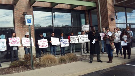 About two dozen young adults, mostly students protested at the Secretary of States office on Stadium until Public Safety asked them to leave. About two dozen young adults, mostly students protested at the Secretary of States office on Stadium until Public Safety asked them to leave.