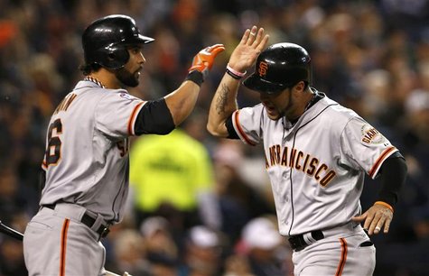 San Francisco Giants' Angel Pagan (L) congratulates Gregor Blanco after he scored against the Detroit Tigers in the second inning during Gam San Francisco Giants' Angel Pagan (L) congratulates Gregor Blanco after he scored against the Detroit Tigers in the second inning during Gam