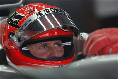 Mercedes Formula One driver Michael Schumacher of Germany sits in his car during the third practice session of the Indian F1 Grand Prix at t Mercedes Formula One driver Michael Schumacher of Germany sits in his car during the third practice session of the Indian F1 Grand Prix at t