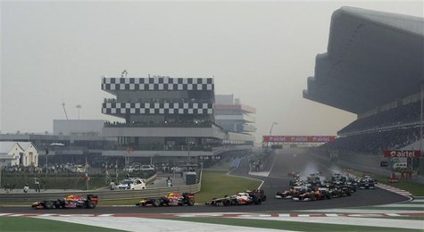 Red Bull Formula One driver Sebastian Vettel (L) of Germany leads on the first turn of the Indian F1 Grand Prix at the Buddh International C Red Bull Formula One driver Sebastian Vettel (L) of Germany leads on the first turn of the Indian F1 Grand Prix at the Buddh International C
