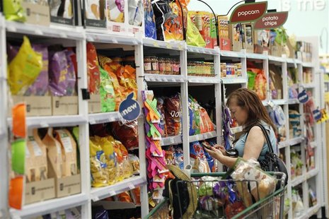 A shopper browses items inside a Fresh & Easy store in Burbank, California October 19, 2012. REUTERS/Mario Anzuoni A shopper browses items inside a Fresh & Easy store in Burbank, California October 19, 2012. REUTERS/Mario Anzuoni