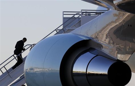 U.S. President Barack Obama walks up the steps to Air Force One before he departs Orlando to return to Washington after cancelling his campa U.S. President Barack Obama walks up the steps to Air Force One before he departs Orlando to return to Washington after cancelling his campa