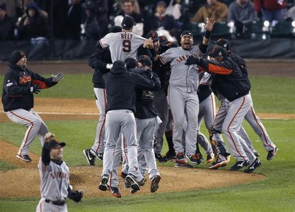 San Francisco Giants players celebrate after defeating the Detroit Tigers to win the MLB World Series baseball championship in Detroit, Mich San Francisco Giants players celebrate after defeating the Detroit Tigers to win the MLB World Series baseball championship in Detroit, Mich