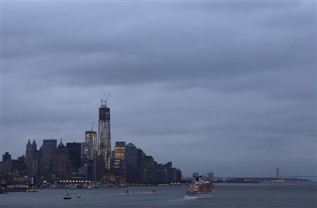 Gray skies hover over the skyline of New York's Lower Manhattan as a cruise ship sails from its port on the Hudson River as seen from Weehawken, New Jersey, October 28, 2012 Gray skies hover over the skyline of New York's Lower Manhattan as a cruise ship sails from its port on the Hudson River as seen from Weehawken, New Jersey, October 28, 2012
