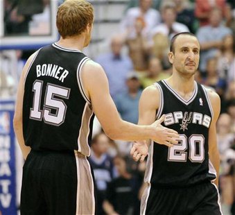 San Antonio Spurs power forward Matt Bonner (15) congratulates shooting guard Manu Ginobili (20) during the second half of their NBA basketb San Antonio Spurs power forward Matt Bonner (15) congratulates shooting guard Manu Ginobili (20) during the second half of their NBA basketb