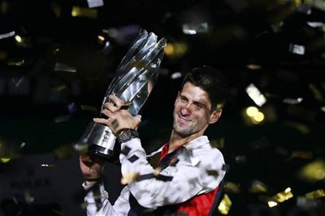 Novak Djokovic of Serbia celebrates with his trophy after winning the men's singles final against Andy Murray of Britain at the Shanghai Mas Novak Djokovic of Serbia celebrates with his trophy after winning the men's singles final against Andy Murray of Britain at the Shanghai Mas