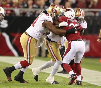 Arizona Cardinals LaRod Stephens-Howling gets smothered by San Francisco 49ers defense in the first half during their NFL football game in P Arizona Cardinals LaRod Stephens-Howling gets smothered by San Francisco 49ers defense in the first half during their NFL football game in P