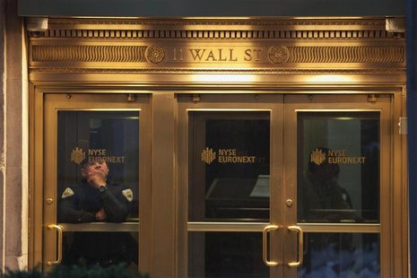 A security guard is seen at the New York Stock Exchange in downtown Manhattan as Hurricane Sandy makes its approach in New York October 29, A security guard is seen at the New York Stock Exchange in downtown Manhattan as Hurricane Sandy makes its approach in New York October 29,