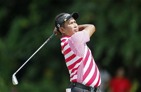 Thaworn Wiratchant of Thailand watches his shot on the first hole during the Malaysia's Asia Pacific Classic golf tournament in Kuala Lumpur Thaworn Wiratchant of Thailand watches his shot on the first hole during the Malaysia's Asia Pacific Classic golf tournament in Kuala Lumpur