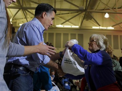 U.S. Republican presidential nominee Mitt Romney accepts relief supplies for people affected by Hurricane Sandy at a storm relief campaign e U.S. Republican presidential nominee Mitt Romney accepts relief supplies for people affected by Hurricane Sandy at a storm relief campaign e