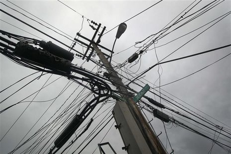 Power lines devastated by fire and the effects of Hurricane Sandy are seen in the Breezy Point section of the Queens borough of New York Oct Power lines devastated by fire and the effects of Hurricane Sandy are seen in the Breezy Point section of the Queens borough of New York Oct