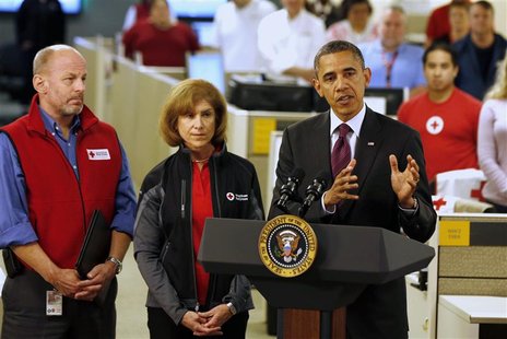 U.S. President Barack Obama (R) talks about damage done by Hurricane Sandy and rescue efforts while at the National Red Cross Headquarters i U.S. President Barack Obama (R) talks about damage done by Hurricane Sandy and rescue efforts while at the National Red Cross Headquarters i