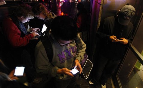 People congregate in front of a building that still has wireless internet access in the aftermath of Hurricane Sandy in New York October 30, People congregate in front of a building that still has wireless internet access in the aftermath of Hurricane Sandy in New York October 30,