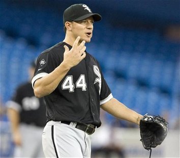 Chicago White Sox starting pitcher Jake Peavy gestures at Toronto Blue Jays Moises Sierra on first base after he hit a single in the second Chicago White Sox starting pitcher Jake Peavy gestures at Toronto Blue Jays Moises Sierra on first base after he hit a single in the second