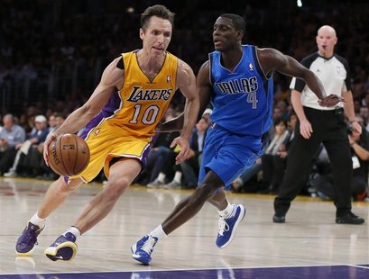 Los Angeles Lakers point guard Steve Nash (10) drives up the key against Dallas Mavericks point guard Darren Collison (4) in the first quart Los Angeles Lakers point guard Steve Nash (10) drives up the key against Dallas Mavericks point guard Darren Collison (4) in the first quart