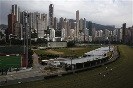 Luxurious residential blocks are seen behind Happy Valley horse racing track in Hong Kong October 26, 2012. REUTERS/Bobby Yip Luxurious residential blocks are seen behind Happy Valley horse racing track in Hong Kong October 26, 2012. REUTERS/Bobby Yip