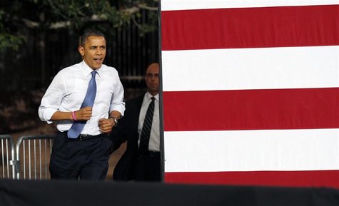 U.S. President Barack Obama jogs into a campaign rally in Las Vegas, Nevada October 24, 2012. Obama is on a two-day, eight state, campaign s U.S. President Barack Obama jogs into a campaign rally in Las Vegas, Nevada October 24, 2012. Obama is on a two-day, eight state, campaign s