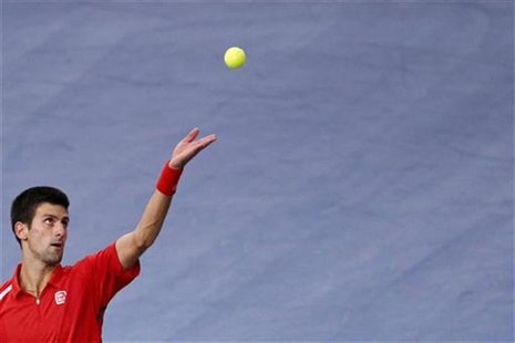 Novak Djokovic of Serbia serves the ball during his match against Sam Querrey of the U.S. during the Paris Masters tennis tournament October Novak Djokovic of Serbia serves the ball during his match against Sam Querrey of the U.S. during the Paris Masters tennis tournament October