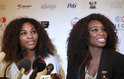 U.S tennis players Serena Williams (L) and Venus Williams smile during a news conference in Nigeria's commercial capital Lagos October 31, 2 U.S tennis players Serena Williams (L) and Venus Williams smile during a news conference in Nigeria's commercial capital Lagos October 31, 2