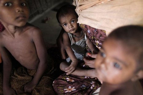 Rohingya children, who fled the recent violence of Myanmar, sit in a house as they hide with other relatives in Teknaf October 30, 2012. REU Rohingya children, who fled the recent violence of Myanmar, sit in a house as they hide with other relatives in Teknaf October 30, 2012. REU