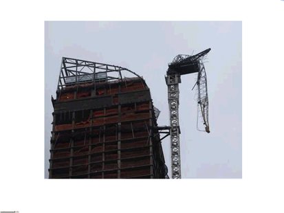 A damaged crane hangs over West 57th Street in New York City. Photo courtesy of Reuters. A damaged crane hangs over West 57th Street in New York City. Photo courtesy of Reuters.