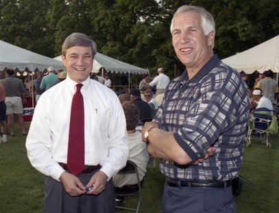 Penn State University President Graham Spanier (L) and Second Mile founder and Penn State assistant football coach Jerry Sandusky, attend th Penn State University President Graham Spanier (L) and Second Mile founder and Penn State assistant football coach Jerry Sandusky, attend th