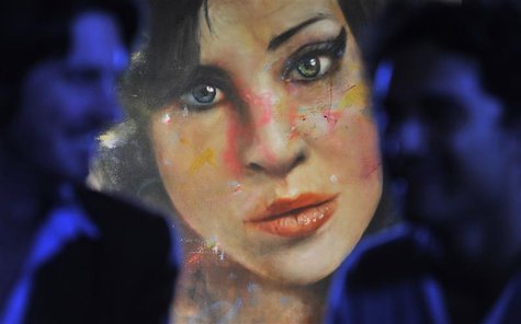 A painting 'Amy' by British artist Johan Andersson is seen hanging at a pub in central London August 23, 2011. REUTERS/Toby Melville A painting 'Amy' by British artist Johan Andersson is seen hanging at a pub in central London August 23, 2011. REUTERS/Toby Melville
