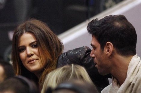 Celebrity Khloe Kardashian (L) watches the second half of the NBA basketball game between the Dallas Mavericks and the Miami Heat in Dallas, Celebrity Khloe Kardashian (L) watches the second half of the NBA basketball game between the Dallas Mavericks and the Miami Heat in Dallas,