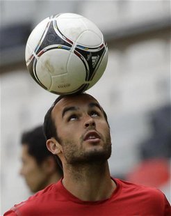 U.S. national soccer player Landon Donovan controls the ball during a practice session at the Azteca stadium in Mexico City August 14, 2012. U.S. national soccer player Landon Donovan controls the ball during a practice session at the Azteca stadium in Mexico City August 14, 2012.