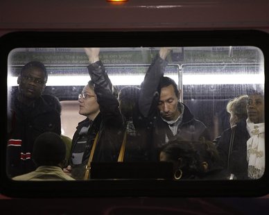 People travel in a bus from Manhattan back to the Brooklyn borough in the aftermath of Hurricane Sandy in New York November 1, 2012. REUTERS People travel in a bus from Manhattan back to the Brooklyn borough in the aftermath of Hurricane Sandy in New York November 1, 2012. REUTERS