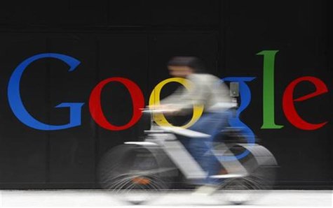 An employee rides her bike past a logo next to the main entrance of the Google building in Zurich July 9, 2009. REUTERS/Christian Hartmann An employee rides her bike past a logo next to the main entrance of the Google building in Zurich July 9, 2009. REUTERS/Christian Hartmann