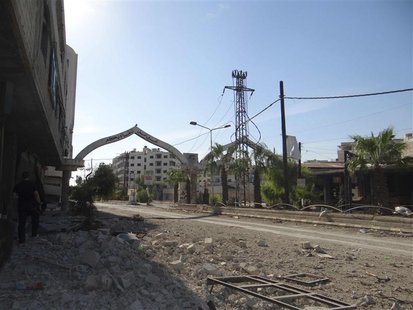 A view shows buildings damaged by what activists say were missiles fired by a Syrian Air Force fighter jet loyal to Syria's President Bashar A view shows buildings damaged by what activists say were missiles fired by a Syrian Air Force fighter jet loyal to Syria's President Bashar