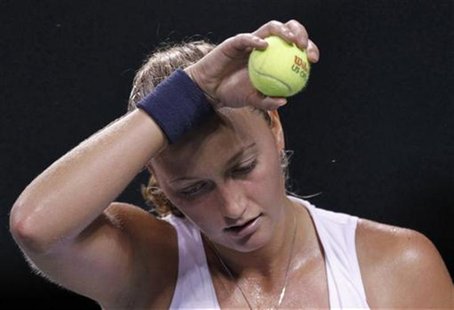 Petra Kvitova of the Czech Republic wipes her forehead after missing a shot against Petra Martic of Croatia at the Pan Pacific Open tennis t Petra Kvitova of the Czech Republic wipes her forehead after missing a shot against Petra Martic of Croatia at the Pan Pacific Open tennis t