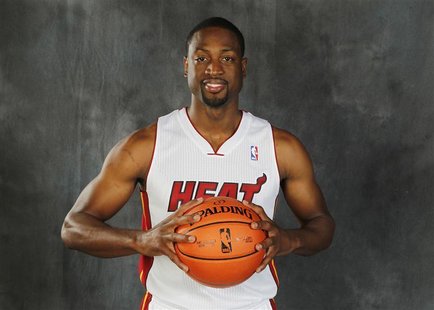 Miami Heat guard Dwyane Wade poses during the team's media day in Miami, Florida, September 28, 2012. REUTERS/Joe Skipper Miami Heat guard Dwyane Wade poses during the team's media day in Miami, Florida, September 28, 2012. REUTERS/Joe Skipper