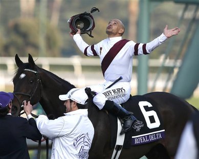 Mike Smith celebrates atop Royal Delta as he becomes the all-time winningest Breeders' Cup jockey after his victory in the running of the Br Mike Smith celebrates atop Royal Delta as he becomes the all-time winningest Breeders' Cup jockey after his victory in the running of the Br
