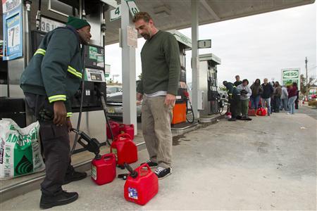 Ovid Thompson (L) fills gasoline cans at a gas station for Bill Poland so he can fuel his car and generator in Neptune, New Jersey, November 2, 2012 in the aftermath of Hurricane Sandy. Credit: REUTERS/Tom Mihalek Ovid Thompson (L) fills gasoline cans at a gas station for Bill Poland so he can fuel his car and generator in Neptune, New Jersey, November 2, 2012 in the aftermath of Hurricane Sandy. Credit: REUTERS/Tom Mihalek