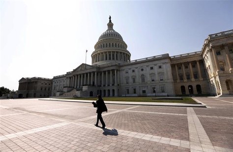 A woman walks past the U.S. Capitol in Washington September 25, 2012. REUTERS/Kevin Lamarque A woman walks past the U.S. Capitol in Washington September 25, 2012. REUTERS/Kevin Lamarque