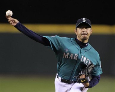 Seattle Mariners starting pitcher Hisashi Iwakuma throws against Texas Rangers leadoff batter Ian Kinsler during the first inning of their A Seattle Mariners starting pitcher Hisashi Iwakuma throws against Texas Rangers leadoff batter Ian Kinsler during the first inning of their A