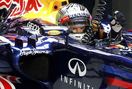Red Bull Formula One driver Sebastian Vettel of Germany sits in his car during the qualifying session of the Abu Dhabi F1 Grand Prix at the Red Bull Formula One driver Sebastian Vettel of Germany sits in his car during the qualifying session of the Abu Dhabi F1 Grand Prix at the