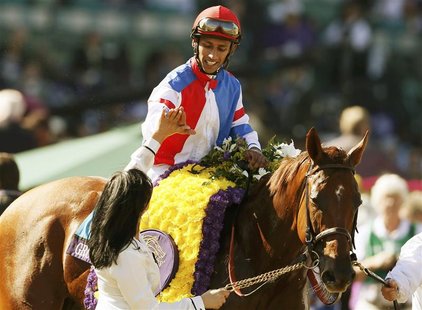 Horse Groupie Doll with Rajiv Maragh in the iron celebrates winning first place during the running of the Breeders' Cup Filly & Mare Sprint Horse Groupie Doll with Rajiv Maragh in the iron celebrates winning first place during the running of the Breeders' Cup Filly & Mare Sprint