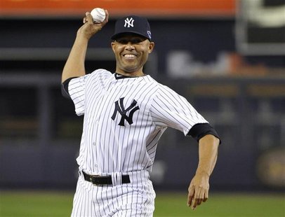 Injured New York Yankees closer Mariano Rivera throws out the ceremonial first pitch before Game 3 of their MLB ALDS baseball playoff series Injured New York Yankees closer Mariano Rivera throws out the ceremonial first pitch before Game 3 of their MLB ALDS baseball playoff series