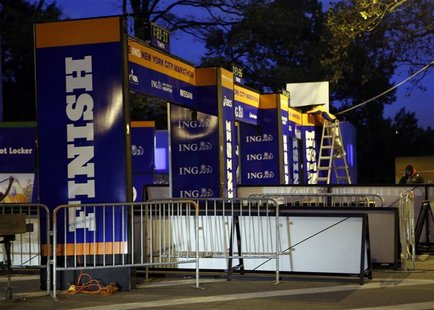 Workers adjust the finish line of the 2012 ING Marathon after the race was canceled due to Hurricane Sandy, in New York, November 2, 2012. R Workers adjust the finish line of the 2012 ING Marathon after the race was canceled due to Hurricane Sandy, in New York, November 2, 2012. R