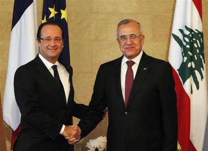 France's President Francois Hollande (L) shakes hands with Lebanon's President Michel Suleiman at the presidential palace in Baabda, near Be France's President Francois Hollande (L) shakes hands with Lebanon's President Michel Suleiman at the presidential palace in Baabda, near Be
