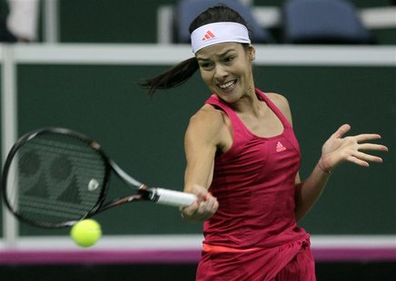 Serbia's Ana Ivanovic returns a ball to Czech Republic's Petra Kvitova during their final match of the Fed Cup tennis tournament in Prague N Serbia's Ana Ivanovic returns a ball to Czech Republic's Petra Kvitova during their final match of the Fed Cup tennis tournament in Prague N