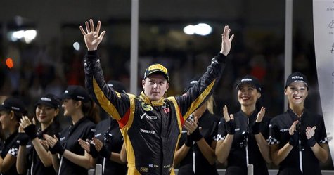 Lotus F1 Formula One driver Kimi Raikkonen of Finland celebrates after winning the Abu Dhabi F1 Grand Prix at the Yas Marina circuit on Yas Lotus F1 Formula One driver Kimi Raikkonen of Finland celebrates after winning the Abu Dhabi F1 Grand Prix at the Yas Marina circuit on Yas
