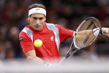 David Ferrer of Spain returns the ball during his final men's singles match against Jerzy Janowicz of Poland at the Paris Masters tennis tou David Ferrer of Spain returns the ball during his final men's singles match against Jerzy Janowicz of Poland at the Paris Masters tennis tou