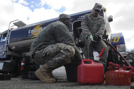 Army Sgt. Adama Ilbouda (L) with the New York Army National Guard, and Tech. Sgt. David Tayler, distribute fuel at the Staten Island Armory Army Sgt. Adama Ilbouda (L) with the New York Army National Guard, and Tech. Sgt. David Tayler, distribute fuel at the Staten Island Armory