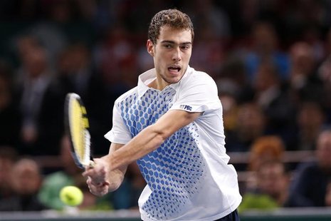 Jerzy Janowicz of Poland returns the ball during his final men's singles match against David Ferrer of Spain at the Paris Masters tennis tou Jerzy Janowicz of Poland returns the ball during his final men's singles match against David Ferrer of Spain at the Paris Masters tennis tou