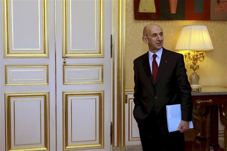 French General commissioner for investment Louis Gallois waits outside France's Prime Minister Jean-Marc Ayrault's office to hand over his r French General commissioner for investment Louis Gallois waits outside France's Prime Minister Jean-Marc Ayrault's office to hand over his r